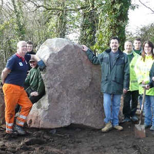 The landscaping team, stone masons, delivery truck driver, Halam Memorial Group and Shani from Notts. County Council with the memorial stone in its final position