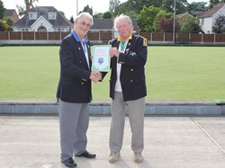 Treasurer Denis Smith presented with a framed pennant from Cullompton President Bruce Beaton