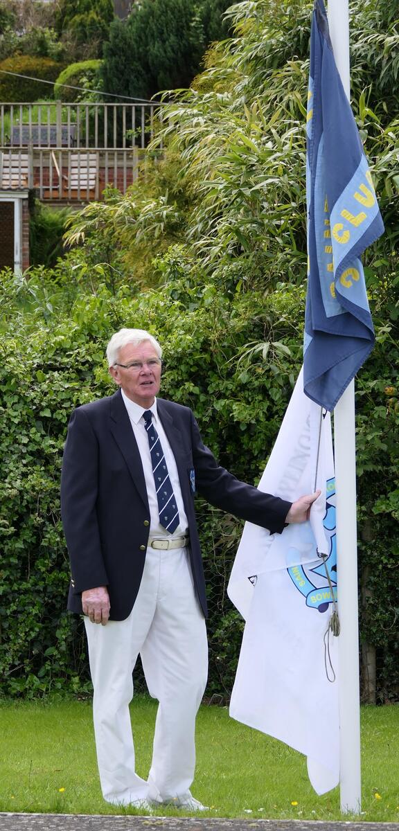 President Colin raises the new club flag