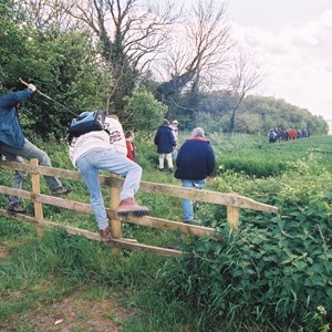 Cimbing the fence at the top of Brick Hill