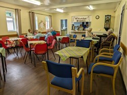 The small hall set up for a coffee morning