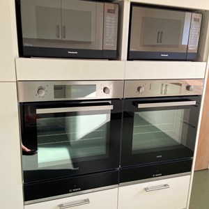Two ovens and two microwaves