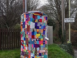 Phonebox jacketed with knitted and crocheted at junction of Southington Lane. ©EH