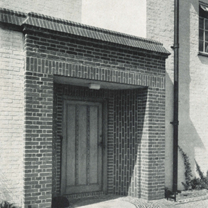 4. The entrance. New Brickwork, with an old millstone on the threshold.