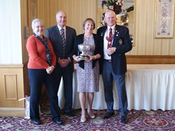 Jane Wray receiving from Brian Smith The Ladies Club Championship trophy along with the Ladies County over 55's competition trophy. On the left of 2016 Club Captains Sue & Mike Summersby.