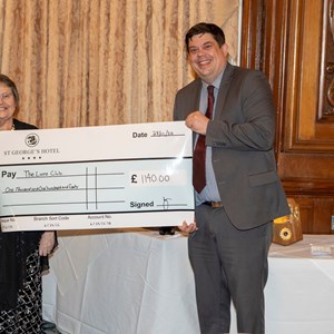 Mr Michael Brackney (GM) presenting a cheque to Llandudno Lions