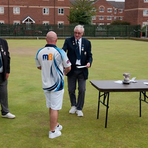 Bob Watcham receives his trophy for EBA Singles Champion 2026