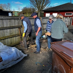Tidying up the surplus top dressing sand