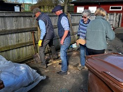 Tidying up the surplus top dressing sand