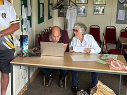 David and Jill Sales updating the scores
