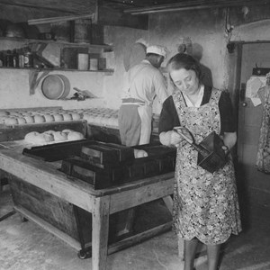 Mrs Brown working in the bakery with Bert Broadby