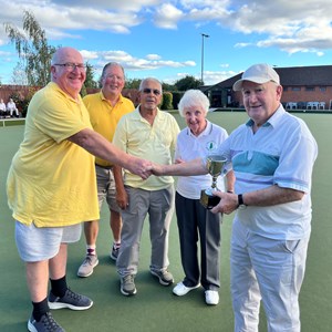 Presentation of the Briffett Cup to the winners by Joyce and Barry.