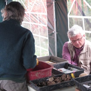Most of the finds come out covered in thick mud so Barbara and Chris are trying their best to clean it off