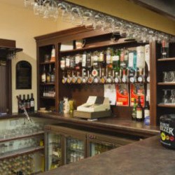 A fully-stocked bar, which can be opened into the hall and lounge.