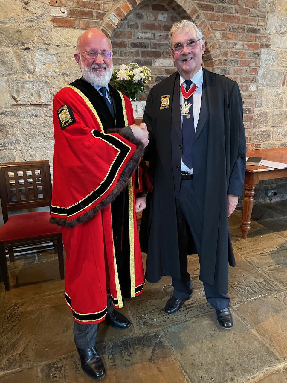 The Guild's Clerk, Tim Hinton, congratulates Richard Geldard (left) on becoming the Master