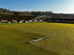 Testing the sprinklers and brushing the dew off
